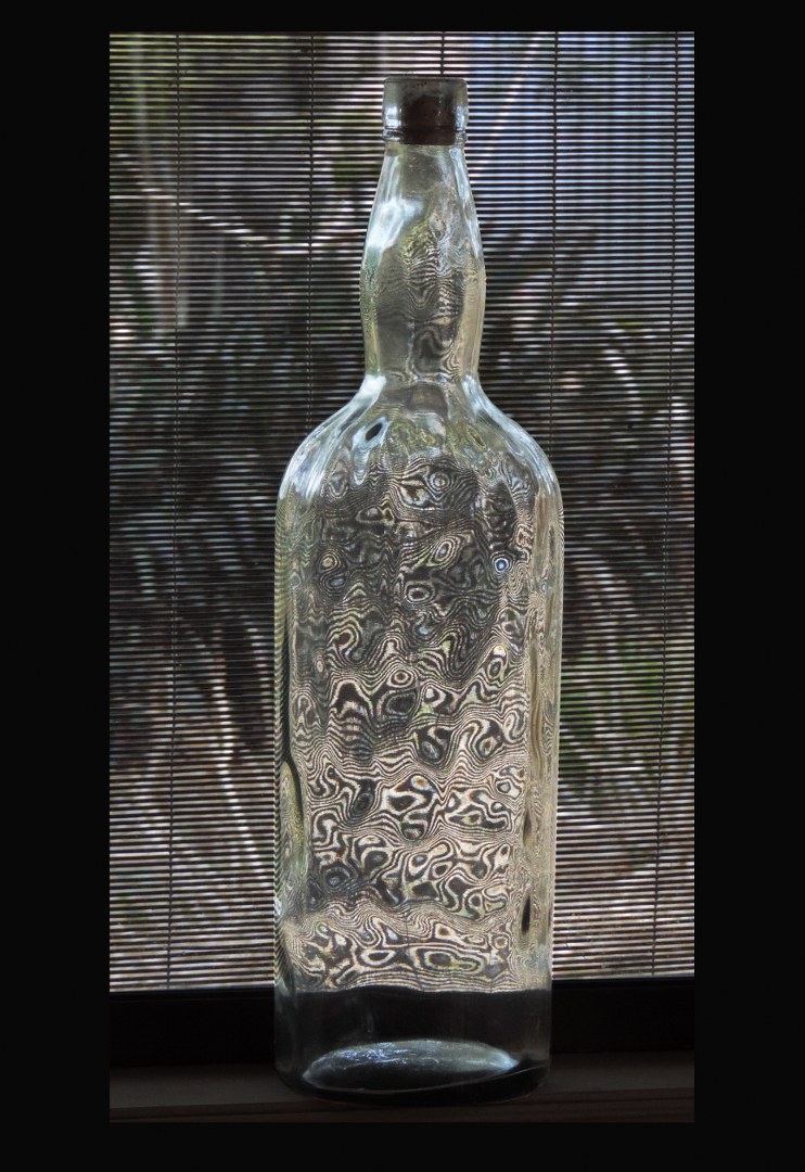 Bottle with wavy glass